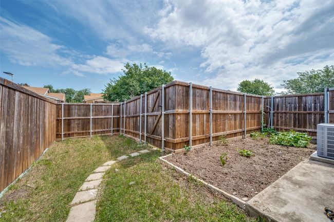 View of fenced backyard | Image 18