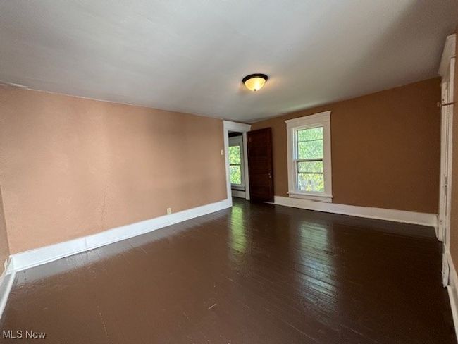 Unfurnished room with dark hardwood / wood-style flooring | Image 17