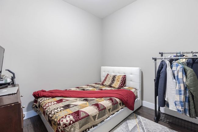 Bedroom featuring wood finished floors and baseboards | Image 31