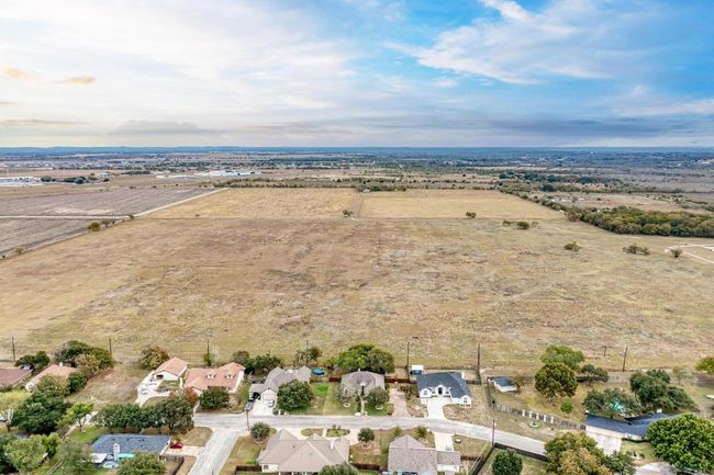 Aerial view of property and surrounding area with rural landscape and nearby suburban area | Image 39