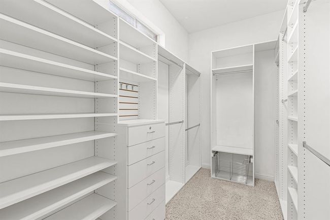 California Closet system allows lots of space for shoes! This closet will keep you organized. A mirror above the shelves bring in natural light. | Image 24