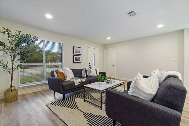 Living room featuring wood finished floors, recessed lighting, visible vents, and baseboards | Image 6