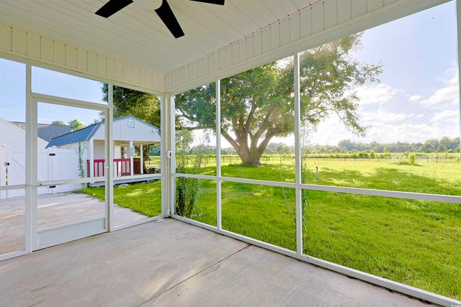 Unfurnished sunroom with ceiling fan | Image 24