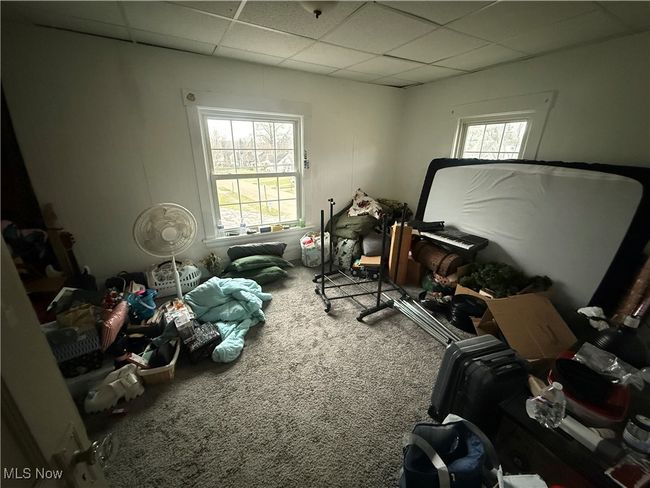 Miscellaneous room with a drop ceiling and carpet flooring | Image 8