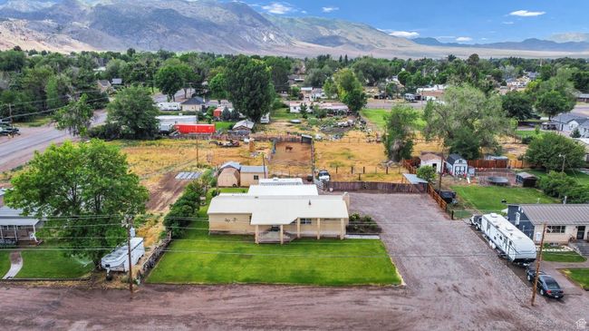 Aerial view of residential area featuring a mountainous background | Image 32