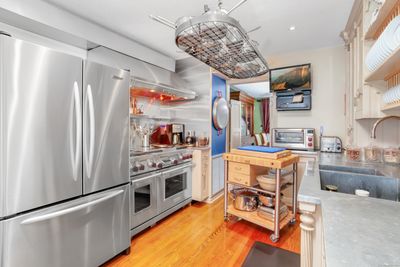 The Kitchen is best described as a chef's dream. It has all the bells and whistles one could ever want, with all top-of-the line, stainless steel appliances. | Image 3