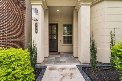 Large covered porch greets your guests. | Image 2