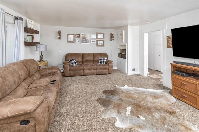 Living room featuring light carpet | Image 8