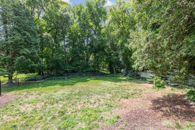 Lots of space to run and play in the back fenced yard | Image 34