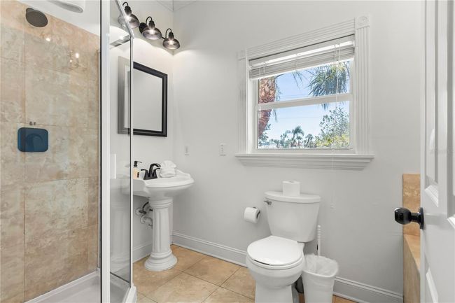 Primary en suite bathroom with separate glassed in shower | Image 23