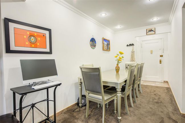 Carpeted dining space featuring ornamental molding and recessed lighting | Image 6