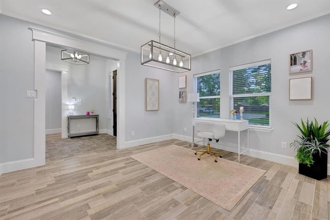 This versatile space offers endless possibilities—perfect for a dining room, office, or flex area to suit your needs | Image 10