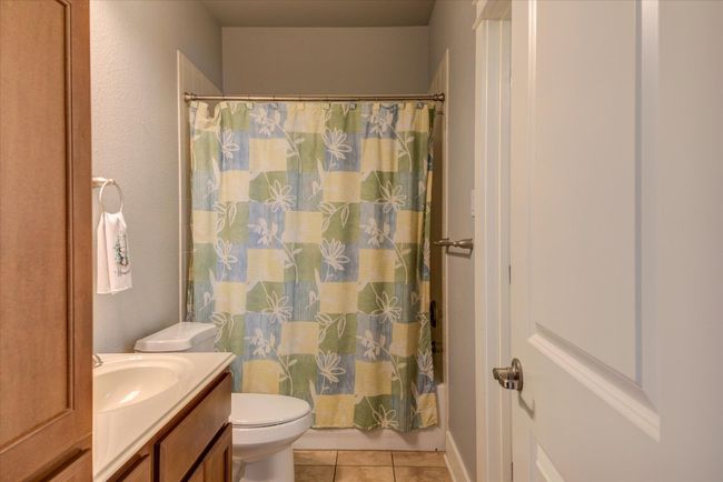 Bathroom with tile patterned flooring, vanity, and toilet | Image 27
