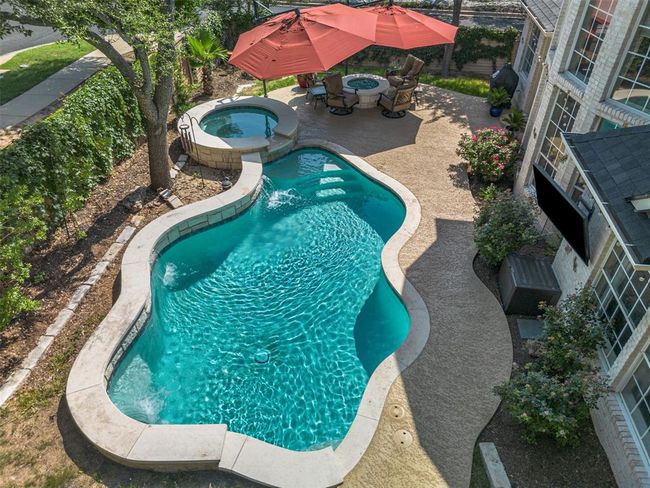 The pool also has a TV mount for an outdoor TV and exterior speakers for music and entertainment. | Image 35