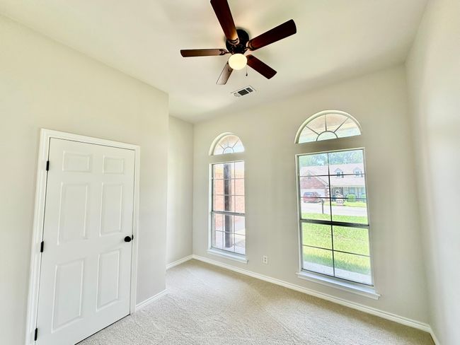 Spare room with light colored carpet and ceiling fan | Image 13