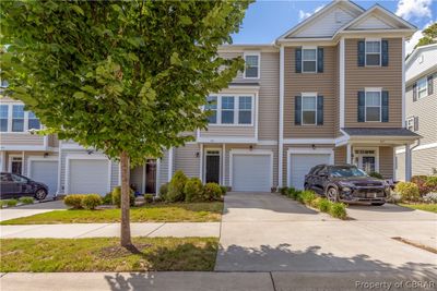 View of property with a garage | Image 1