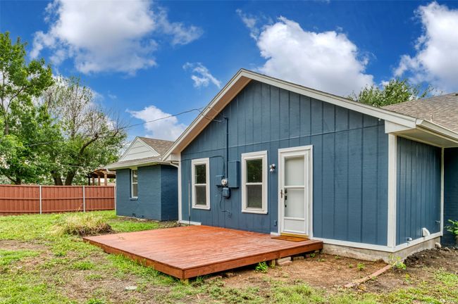 Back of property with a wooden deck and a shingled roof | Image 25