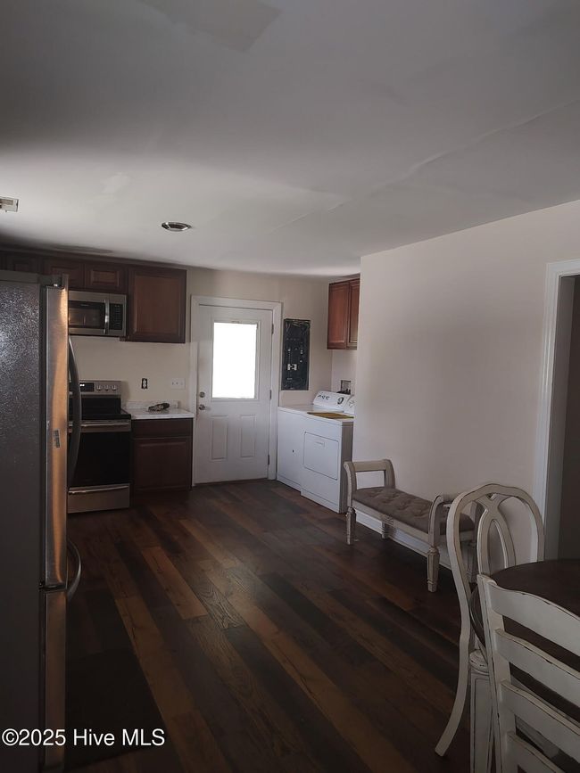 Facing the side door from dining room view. Washer/dryer connection in kitchen. Can also be moved to carport room. | Image 4