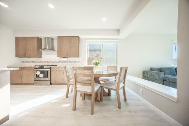 Dining area with light hardwood / wood-style floors | Image 7