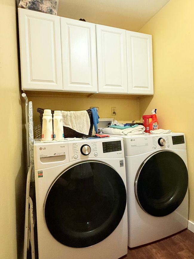 Laundry room with cabinet space, washing machine and dryer included. | Image 24