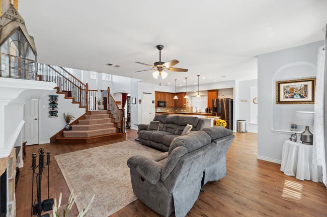 Living room is open to kitchen, breakfast area with beautiful views to backyard pool. | Image 17