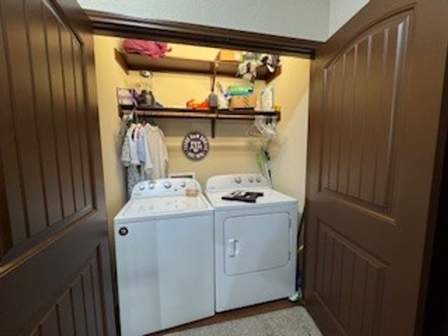 Laundry area with washer and dryer and carpet flooring | Image 12