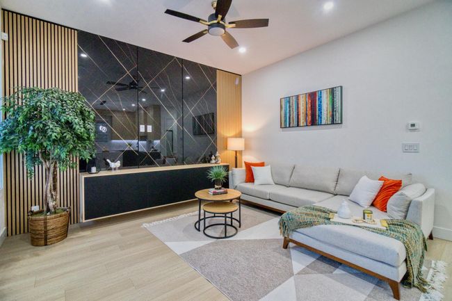 Living area featuring a ceiling fan, recessed lighting, and wood finished floors | Image 7