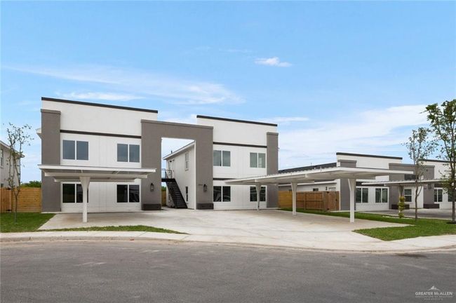 Modern home with stairway and stucco siding | Image 16