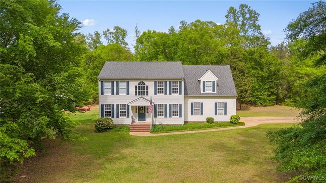 Colonial home with roof with shingles and a front yard | Image 6
