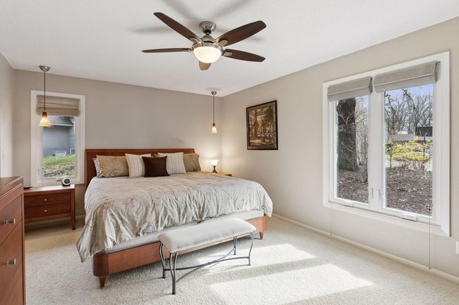 Primary bedroom has a spacious layout | Image 20