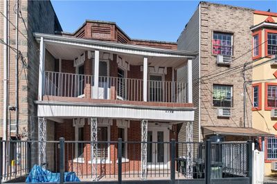 View of front of home with a balcony | Image 2