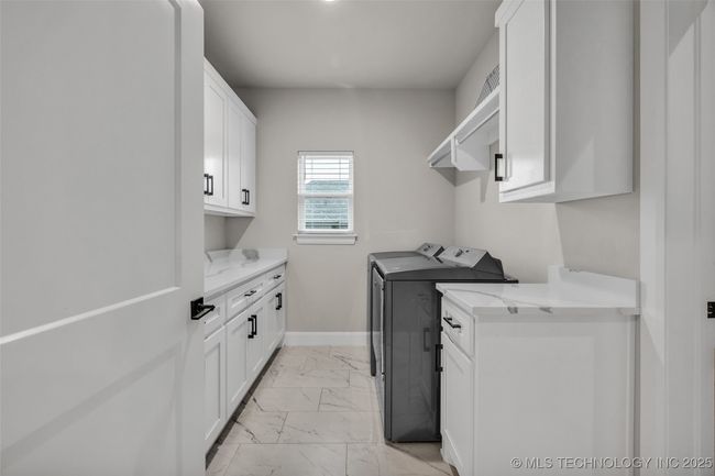 Large laundry room with built-in cabinets | Image 27