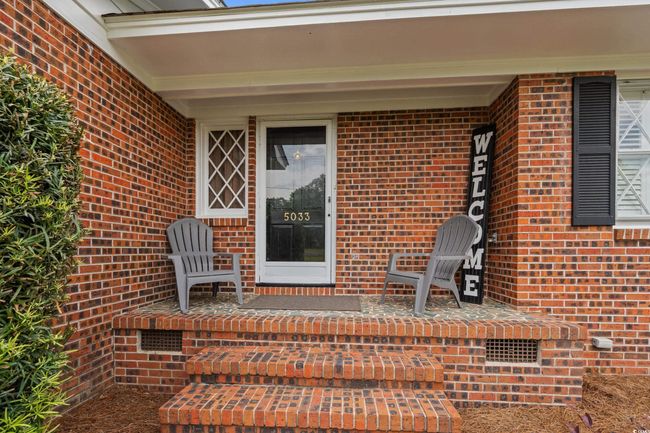 View of exterior entry with brick siding | Image 20