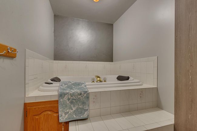 Let the day soak away in your private jetted tub in the primary ensuite | Image 24