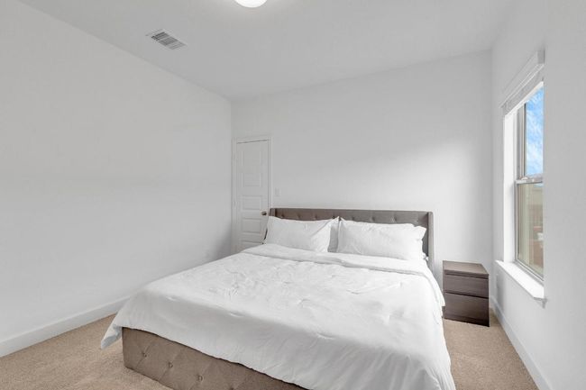 Bedroom featuring carpet and baseboards | Image 35