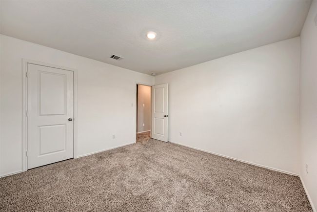 Spare room featuring carpet floors and baseboards | Image 25