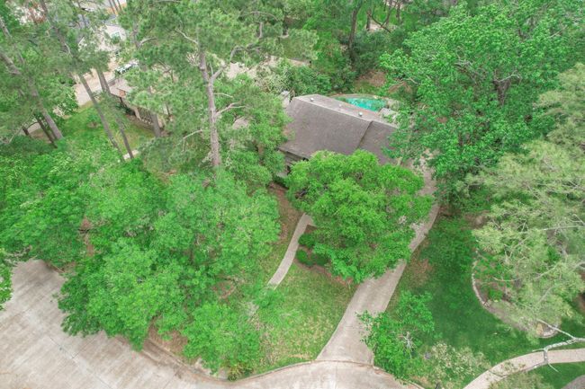 This backyard oasis offers space for outdoor dining, lounging, and making memories. | Image 28