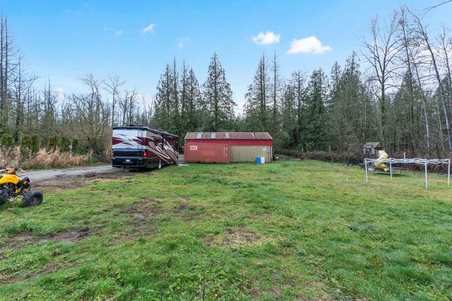 View of yard featuring an outbuilding | Image 29