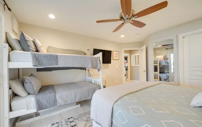 Bedroom featuring wood finished floors, recessed lighting, and a ceiling fan | Image 14