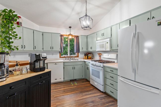 The kitchen updates include painted cabinets, matte black hardware, reverse osmosis system (2024), and new gas stove (2020). All appliances are less than 10 years old. | Image 7