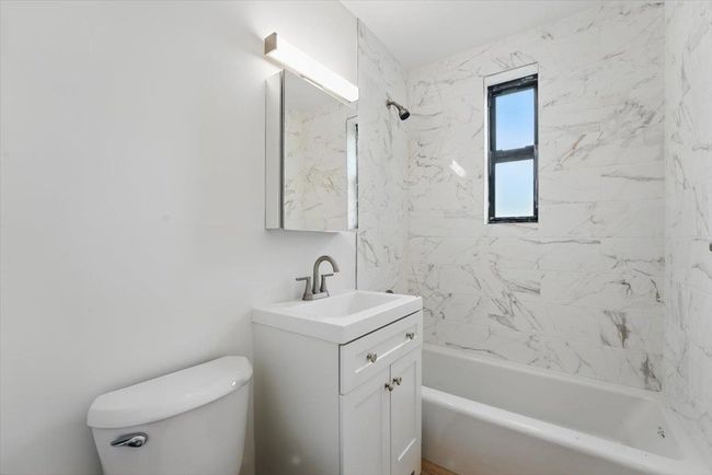 Full bath with shower / bathing tub combination, vanity, and toilet | Image 21