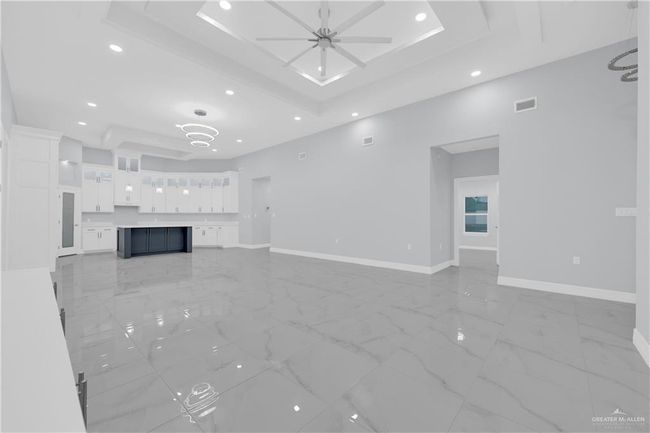 Unfurnished living room featuring visible vents, ceiling fan, finish floor, and baseboards | Image 13