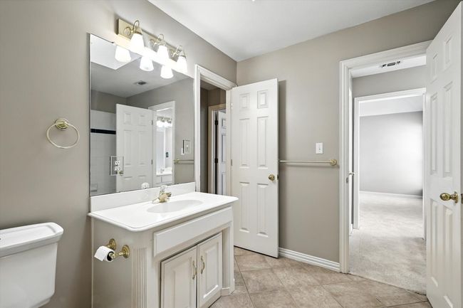 Full bathroom featuring vanity and tile patterned floors | Image 21