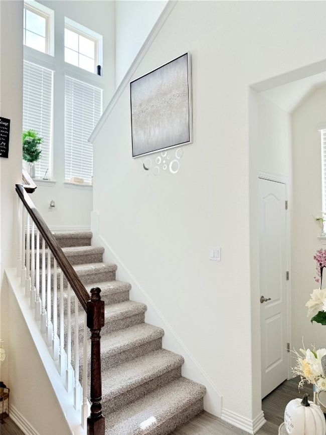 Stairway featuring wood finished floors | Image 15