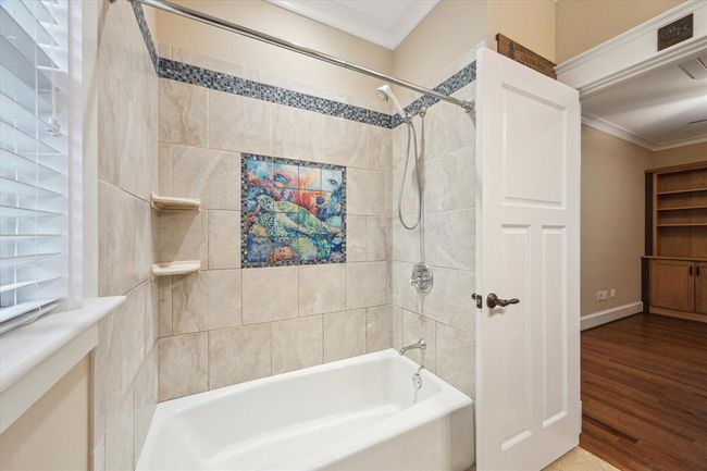 THIS BATHTUB FEATURES A HAND-LAID, ORIGINAL GLASS TILES THAT SHOWCASE A BREATHTAKING TURTLE MOSAIC- AN ARTISTIC MASTERPIECE! FRAMED BY A DELICATE GLASS MOSAIC TILE BORDER AND CUSTOM SHELVES | Image 41