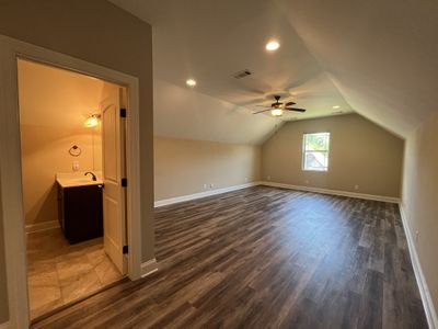 Primary Suite has new hardwood with triple trey ceiling; Large walk in closet and Primary bath has double vanities and separate tub and shower; tile flooring; Primary suite overlooking private fenced backyard | Image 3