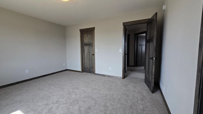 The entrance and walk in closet door in the primary bedroom. | Image 20
