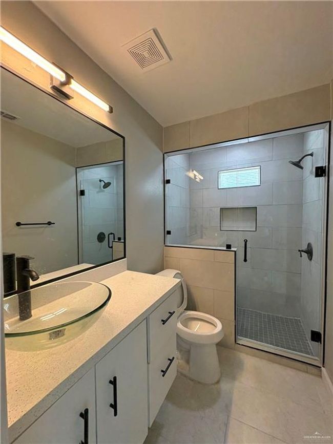 Full bath featuring a stall shower and vanity | Image 5