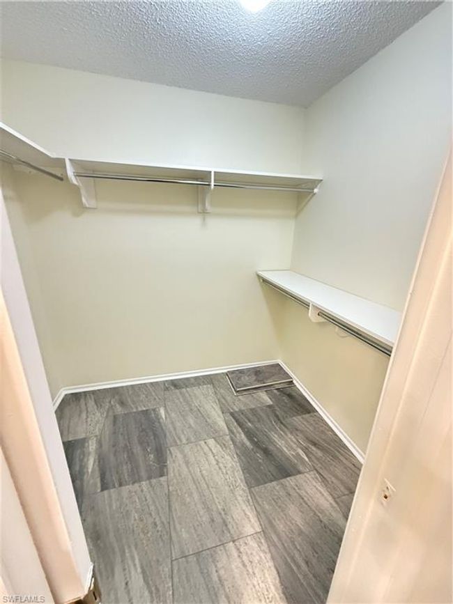 Spacious closet featuring wood finished floors | Image 17