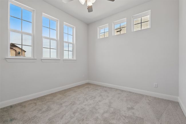 Spare room featuring baseboards, carpet floors, and ceiling fan | Image 25